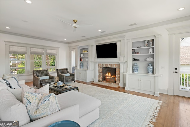 50 Frederica Oaks Ln, Saint Simons, GA 31522 - living room with ceiling fan, healthy amount of natural light, light wood-type flooring, crown molding, and recessed lighting
