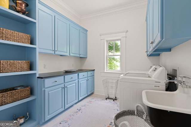 50 Frederica Oaks Ln, Saint Simons, GA 31522 - laundry area featuring cabinet space, washer and dryer, crown molding, and baseboards
