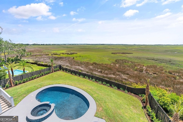 50 Frederica Oaks Ln, Saint Simons, GA 31522 - view of pool featuring a pool with connected hot tub and a view of countryside