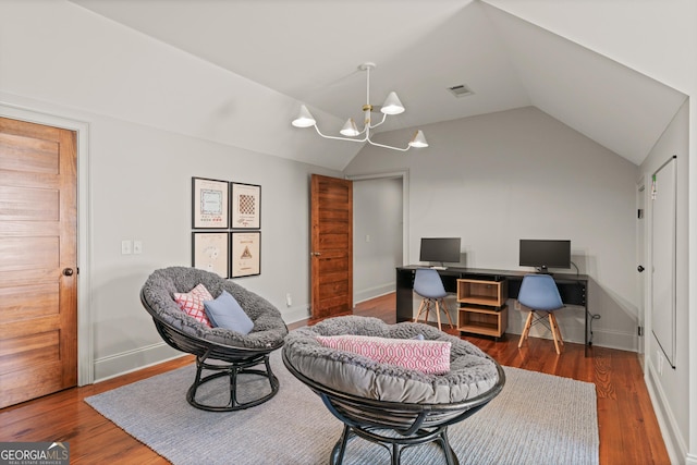 50 Frederica Oaks Ln, Saint Simons, GA 31522 - office area featuring vaulted ceiling, a chandelier, wood finished floors, and baseboards