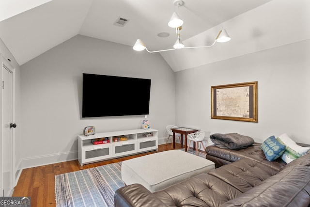 50 Frederica Oaks Ln, Saint Simons, GA 31522 - living room with lofted ceiling, wood finished floors, and baseboards