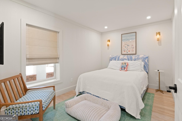 50 Frederica Oaks Ln, Saint Simons, GA 31522 - bedroom with light wood-style flooring, ornamental molding, recessed lighting, and baseboards