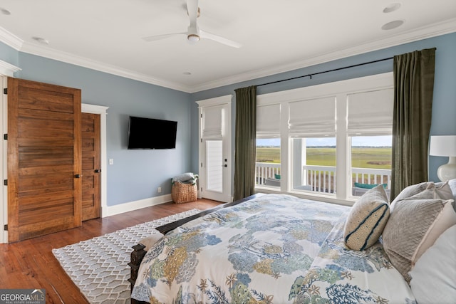 50 Frederica Oaks Ln, Saint Simons, GA 31522 - bedroom featuring ornamental molding, wood finished floors, access to outside, baseboards, and a ceiling fan