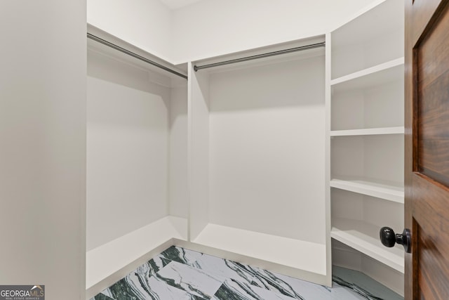 50 Frederica Oaks Ln, Saint Simons, GA 31522 - walk in closet featuring marble finish floors