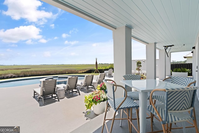 50 Frederica Oaks Ln, Saint Simons, GA 31522 - view of patio featuring an outdoor pool and outdoor dining space