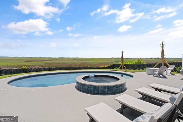 50 Frederica Oaks Ln, Saint Simons, GA 31522 - view of pool with a patio area and a pool with connected hot tub