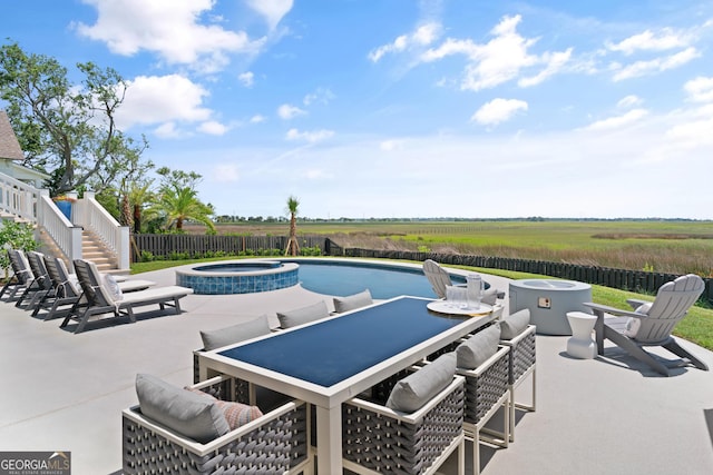 50 Frederica Oaks Ln, Saint Simons, GA 31522 - view of swimming pool featuring a patio, outdoor dining area, stairway, an outdoor fire pit, and a pool with connected hot tub