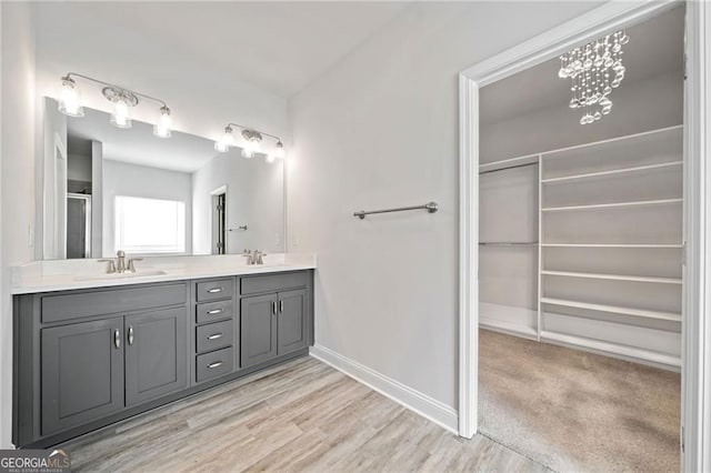 83 Midnight Run N, Dawsonville, GA 30534 - full bathroom with double vanity, wood finished floors, a shower with shower door, and a spacious closet