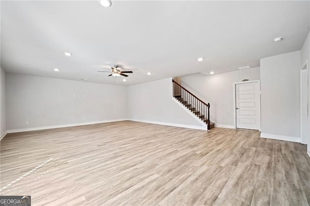 83 Midnight Run N, Dawsonville, GA 30534 - unfurnished living room with recessed lighting, light wood finished floors, ceiling fan, and stairs