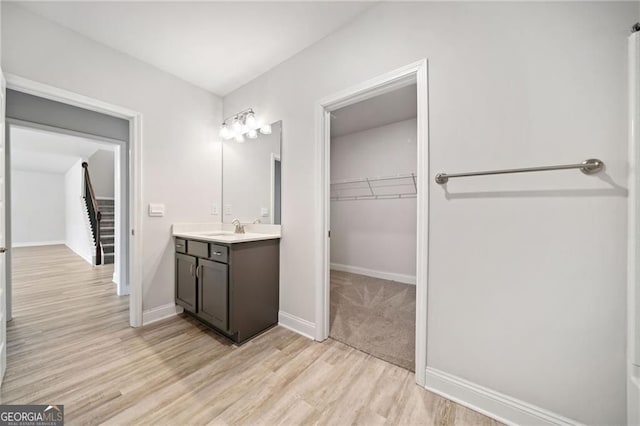 83 Midnight Run N, Dawsonville, GA 30534 - full bathroom featuring vanity, a spacious closet, and wood finished floors