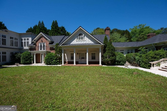 4790 Shallowford Rd, Roswell, GA 30075 - view of front of home featuring a front lawn, french doors, a porch, and a chimney