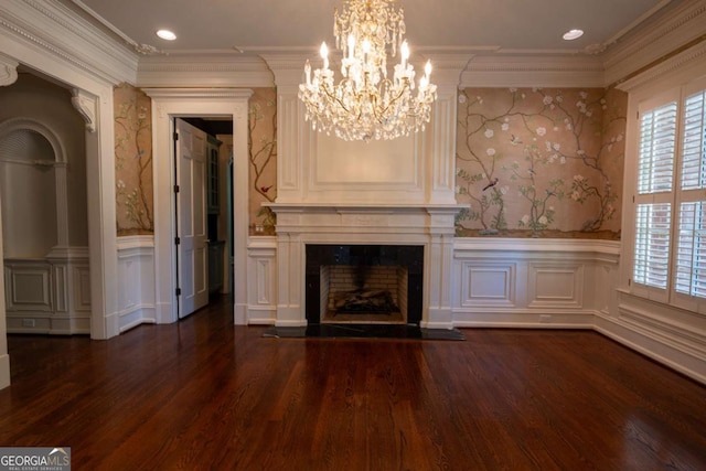 4790 Shallowford Rd, Roswell, GA 30075 - unfurnished living room featuring wainscoting, dark wood-type flooring, wallpapered walls, a chandelier, and ornamental molding