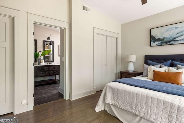 1002 Forrest Blvd, Decatur, GA 30030 - bedroom featuring dark wood-type flooring, a closet, baseboards, and ensuite bath