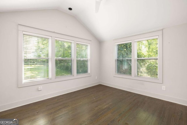 1002 Forrest Blvd, Decatur, GA 30030 - spare room featuring vaulted ceiling, dark wood-style floors, and baseboards