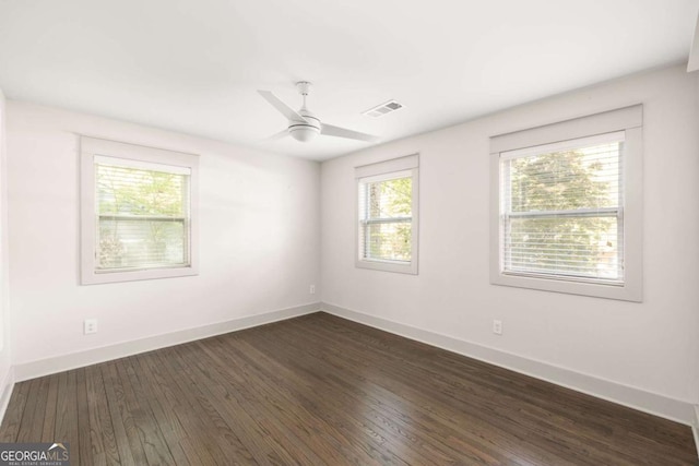 1002 Forrest Blvd, Decatur, GA 30030 - spare room featuring dark wood-style flooring, ceiling fan, and baseboards