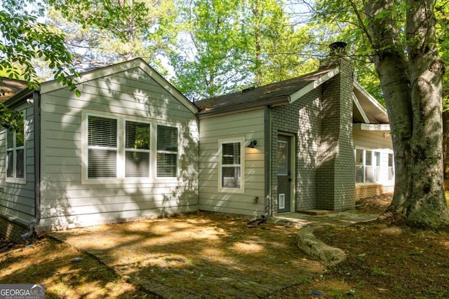 1002 Forrest Blvd, Decatur, GA 30030 - rear view of property featuring a chimney