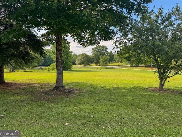 1695 Whitley Rd, Dacula, GA 30019 - surrounding community with a lawn