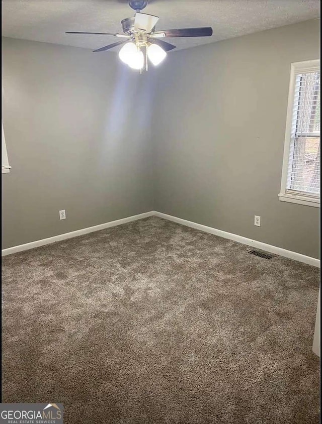 2058 Pair Rd SW, Marietta, GA 30008 - carpeted empty room featuring a ceiling fan and baseboards