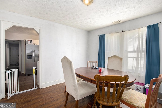 119 Pearl St, Rockmart, GA 30153 - dining space with wood finished floors and a textured ceiling