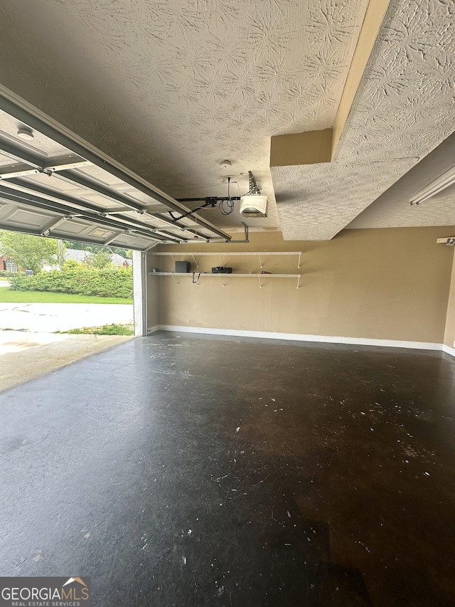 80 Fields Creek Way, Covington, GA 30016 - garage featuring baseboards and a garage door opener