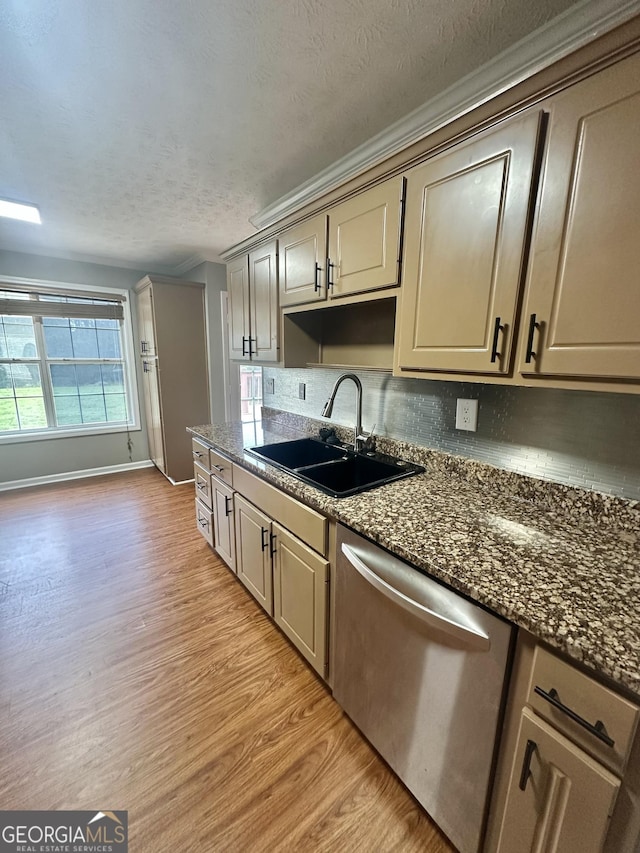80 Fields Creek Way, Covington, GA 30016 - kitchen with stainless steel dishwasher, light wood-style flooring, a textured ceiling, backsplash, and crown molding