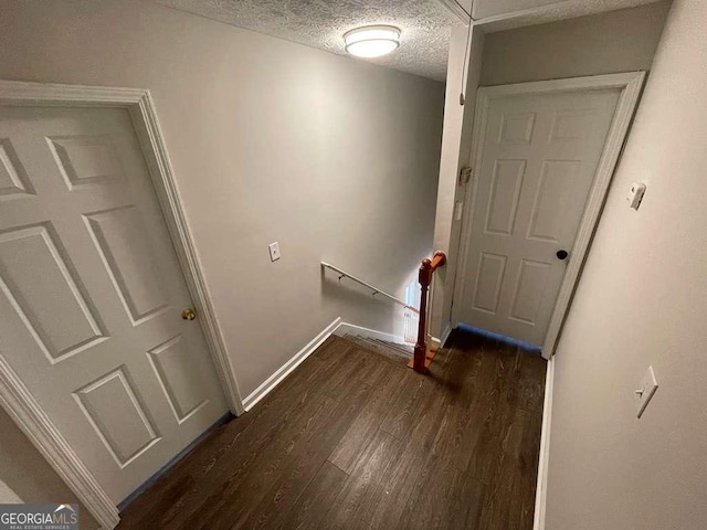 3251 Avensong Village Cir, Milton, GA 30004 - staircase featuring wood finished floors and a textured ceiling