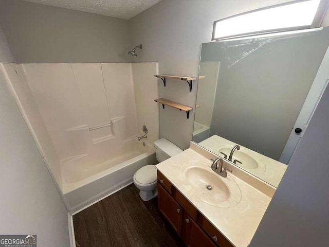 3251 Avensong Village Cir, Milton, GA 30004 - bathroom with shower / washtub combination, vanity, wood finished floors, and a textured ceiling