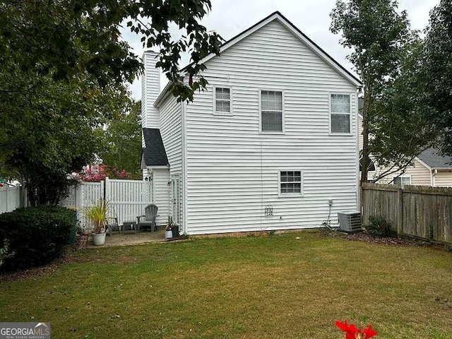 3251 Avensong Village Cir, Milton, GA 30004 - rear view of property with a fenced backyard and a chimney