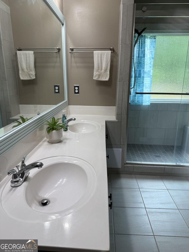 60 Buck Trl, Newnan, GA 30265 - bathroom featuring a stall shower, double vanity, and tile patterned flooring