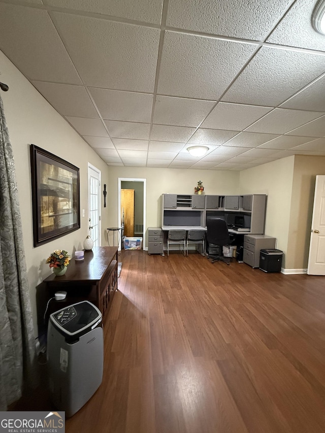 60 Buck Trl, Newnan, GA 30265 - living area featuring a paneled ceiling, wood finished floors, and an office area