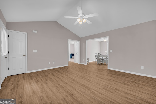 1861 Skyline Dr, Toccoa, GA 30577 - unfurnished living room with a ceiling fan, light wood-type flooring, baseboards, and high vaulted ceiling