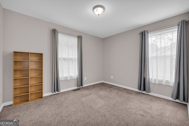1861 Skyline Dr, Toccoa, GA 30577 - empty room with healthy amount of natural light, carpet floors, and baseboards