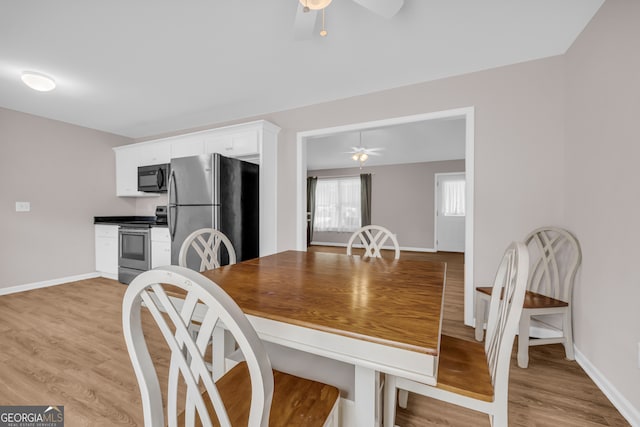 1861 Skyline Dr, Toccoa, GA 30577 - dining space with ceiling fan, light wood-style floors, and baseboards