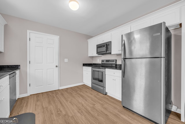 1861 Skyline Dr, Toccoa, GA 30577 - kitchen featuring appliances with stainless steel finishes, white cabinets, light wood-style flooring, and baseboards