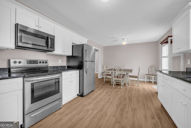 1861 Skyline Dr, Toccoa, GA 30577 - kitchen with appliances with stainless steel finishes, ceiling fan, light wood finished floors, and white cabinets