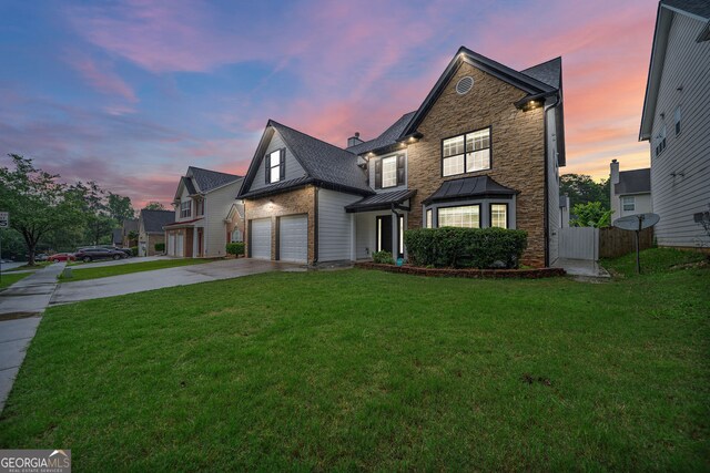 773 Minor Oaks Run NW, Lilburn, GA 30047 - traditional-style home with concrete driveway, a standing seam roof, and a metal roof