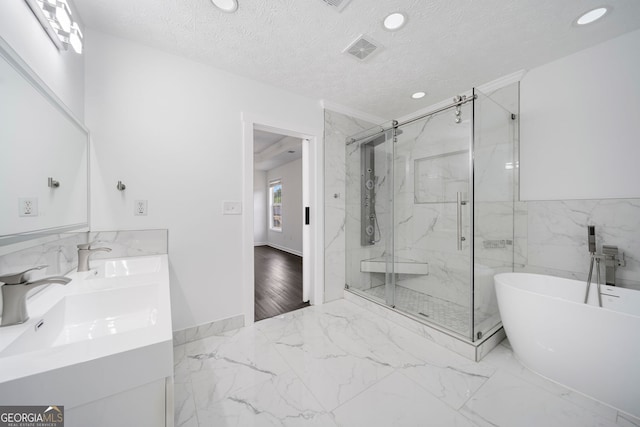 773 Minor Oaks Run NW, Lilburn, GA 30047 - bathroom with recessed lighting, a marble finish shower, a soaking tub, double vanity, and marble finish flooring
