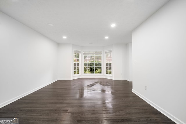 773 Minor Oaks Run NW, Lilburn, GA 30047 - empty room with recessed lighting and dark wood-type flooring