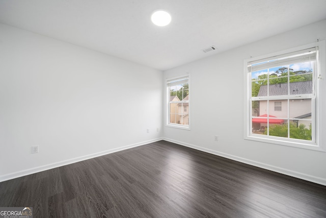 773 Minor Oaks Run NW, Lilburn, GA 30047 - spare room featuring dark wood finished floors and baseboards