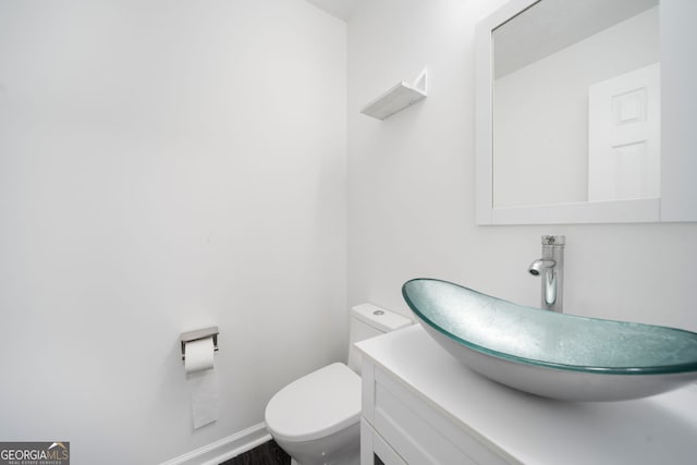 773 Minor Oaks Run NW, Lilburn, GA 30047 - half bathroom featuring toilet and vanity