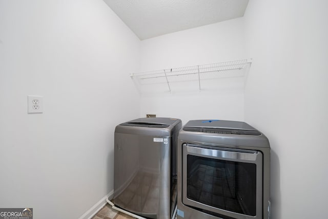 773 Minor Oaks Run NW, Lilburn, GA 30047 - washroom featuring separate washer and dryer and baseboards