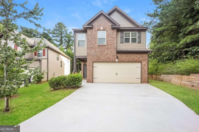 545 Offaly Ln, Atlanta, GA 30349 - view of front facade with brick siding, a garage, concrete driveway, and a front yard