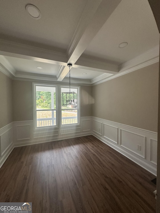 1119 Plantation Dr SE, Conyers, GA 30094 - empty room with a decorative wall, beam ceiling, crown molding, wainscoting, and dark wood-style floors