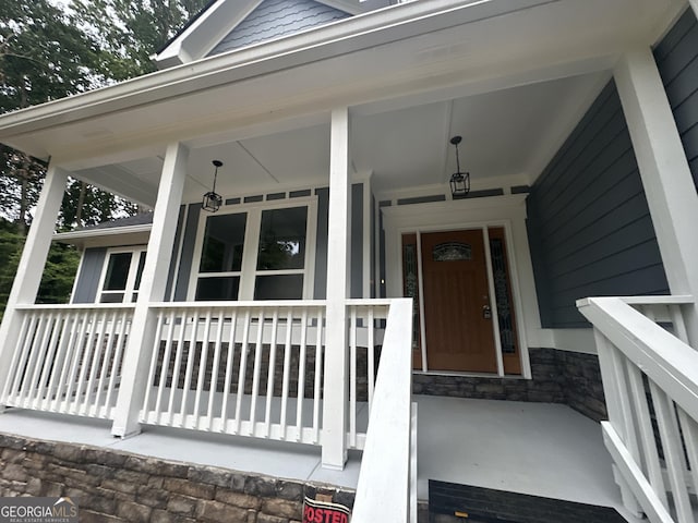 1119 Plantation Dr SE, Conyers, GA 30094 - view of exterior entry with stone siding and covered porch