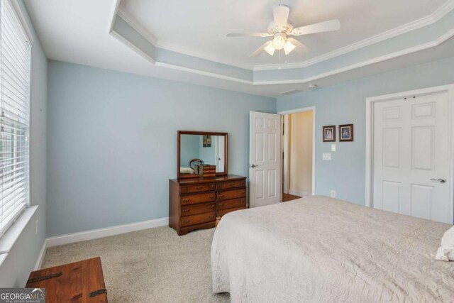 2565 Grapevine Cir Unit 103, Cumming, GA 30041 - bedroom with a tray ceiling, crown molding, carpet floors, and ceiling fan