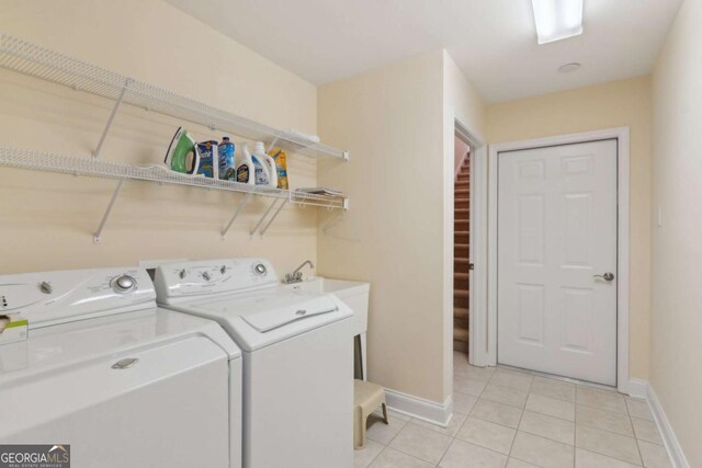 2565 Grapevine Cir Unit 103, Cumming, GA 30041 - laundry room featuring separate washer and dryer and light tile patterned flooring