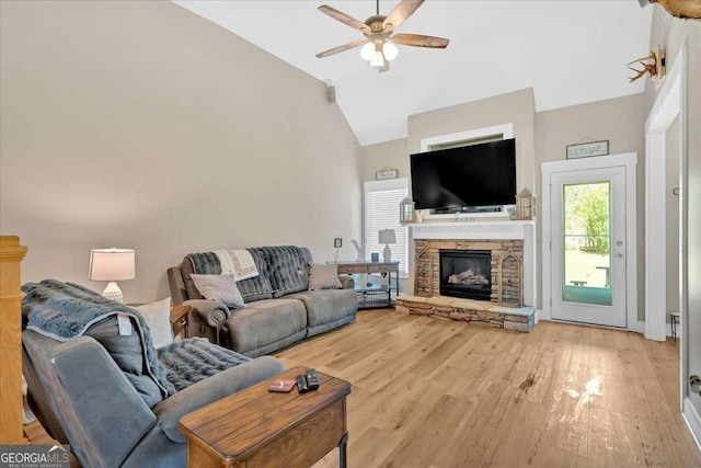 60 Independence Ave, Dallas, GA 30132 - living area with ceiling fan, high vaulted ceiling, light wood finished floors, and a stone fireplace