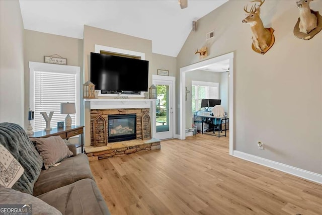 60 Independence Ave, Dallas, GA 30132 - living room with wood finished floors, baseboards, a fireplace, and vaulted ceiling