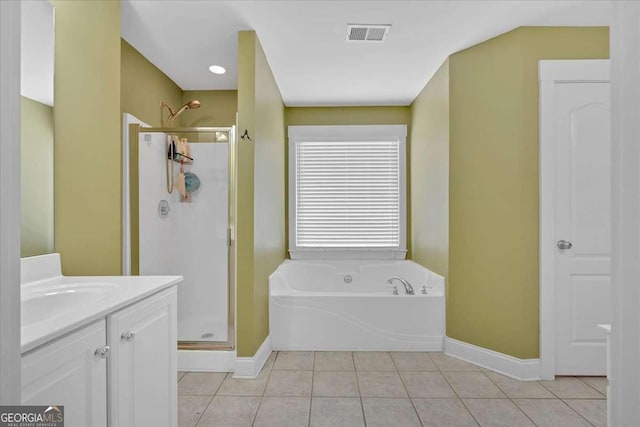 60 Independence Ave, Dallas, GA 30132 - bathroom with a stall shower, baseboards, a garden tub, and tile patterned flooring