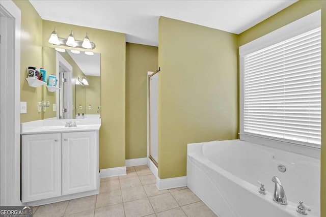 60 Independence Ave, Dallas, GA 30132 - bathroom featuring a bath, vanity, tile patterned flooring, a shower stall, and baseboards